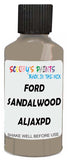 Detail brush applying Beige Solid to a small door scratch on an Ford F-Series F-250/550 Lariet, clean OEM finish