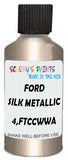 Detail brush applying Beige Metallic to a small door scratch on an Ford Fiesta, clean OEM finish