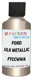 Detail brush applying Beige Metallic to a small door scratch on an Ford Fiesta, clean OEM finish