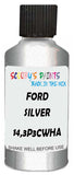 Detail brush applying Silver Metallic to a small door scratch on an Ford Escort, clean OEM finish