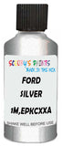 Detail brush applying Silver Metallic to a small door scratch on an Ford F-Series, clean OEM finish