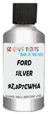 Detail brush applying Silver Metallic to a small door scratch on an Ford Escort, clean OEM finish