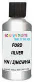 Detail brush applying Silver Metallic to a small door scratch on an Ford Edge Ranger, clean OEM finish