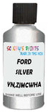 Detail brush applying Silver Metallic to a small door scratch on an Ford Escape, clean OEM finish