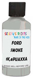 Detail brush applying Grey Solid to a small door scratch on an Ford Escort, clean OEM finish