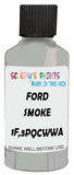 Detail brush applying Grey Solid to a small door scratch on an Ford Tempo, clean OEM finish