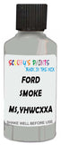 Detail brush applying Grey Solid to a small door scratch on an Ford F-Series, clean OEM finish