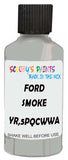 Detail brush applying Grey Solid to a small door scratch on an Ford Heavy Truck, clean OEM finish