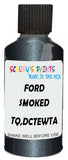 Detail brush applying Grey Metallic to a small door scratch on an Ford Taurus, clean OEM finish