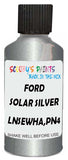 Detail brush applying Silver Metallic to a small door scratch on an Ford Transit Connect, clean OEM finish