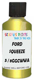 Detail brush applying Green Metallic to a small door scratch on an Ford Figo, clean OEM finish