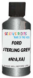 Detail brush applying Grey Metallic to a small door scratch on an Ford Flex, clean OEM finish