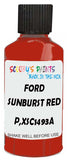 Detail brush applying Red Solid to a small door scratch on an Ford Escort, clean OEM finish