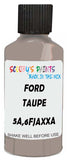 Detail brush applying Beige Solid to a small door scratch on an Ford Taurus, clean OEM finish
