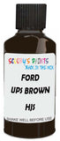 Detail brush applying Brown Solid to a small door scratch on an Ford Truck, clean OEM finish