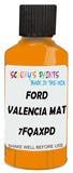 Detail brush applying Orange Solid to a small door scratch on an Ford Ranger, clean OEM finish