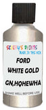 Detail brush applying Gold Metallic to a small door scratch on an Ford F-Series Lariat, clean OEM finish