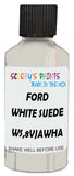 Detail brush applying White Solid to a small door scratch on an Ford Expedition, clean OEM finish