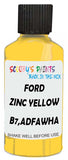 Detail brush applying Yellow Solid to a small door scratch on an Ford Explorer, clean OEM finish