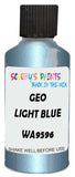Detail brush applying Blue Metallic to a small door scratch on an Geo Metro, clean OEM finish