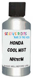 Detail brush applying White Metallic to a small door scratch on an Honda Civic, clean OEM finish