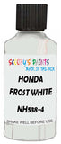 Detail brush applying White Solid to a small door scratch on an Honda Civic, clean OEM finish