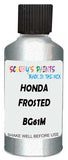 Detail brush applying White Metallic to a small door scratch on an Honda Fit Hybrid, clean OEM finish
