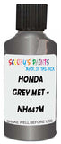 Detail brush applying Grey Metallic to a small door scratch on an Honda Element, clean OEM finish