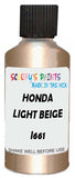 Detail brush applying Beige Metallic to a small door scratch on an Honda Civic, clean OEM finish