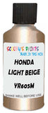 Detail brush applying Beige Metallic to a small door scratch on an Honda Fit Hybrid, clean OEM finish