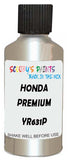 Detail brush applying White Metallic to a small door scratch on an Honda Fit, clean OEM finish