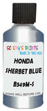 Detail brush applying Blue Metallic to a small door scratch on an Honda Fit, clean OEM finish