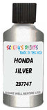 Detail brush applying Silver Metallic to a small door scratch on an Honda Cr-V, clean OEM finish