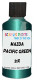 Detail brush applying Green Metallic to a small door scratch on an Mazda 121, clean OEM finish