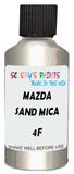 Detail brush applying Beige Metallic to a small door scratch on an Mazda Millenia, clean OEM finish