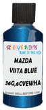 Detail brush applying Blue Metallic to a small door scratch on an Mazda B-Series, clean OEM finish