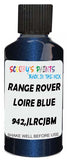 Detail brush applying Blue Metallic to a small door scratch on an Land Rover , clean OEM finish