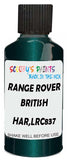 Detail brush applying Green Metallic to a small door scratch on an Land Rover , clean OEM finish