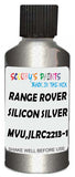 Detail brush applying Silver Metallic to a small door scratch on an Land Rover , clean OEM finish