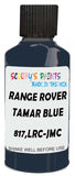Detail brush applying Blue Solid to a small door scratch on an Land Rover Defender, clean OEM finish